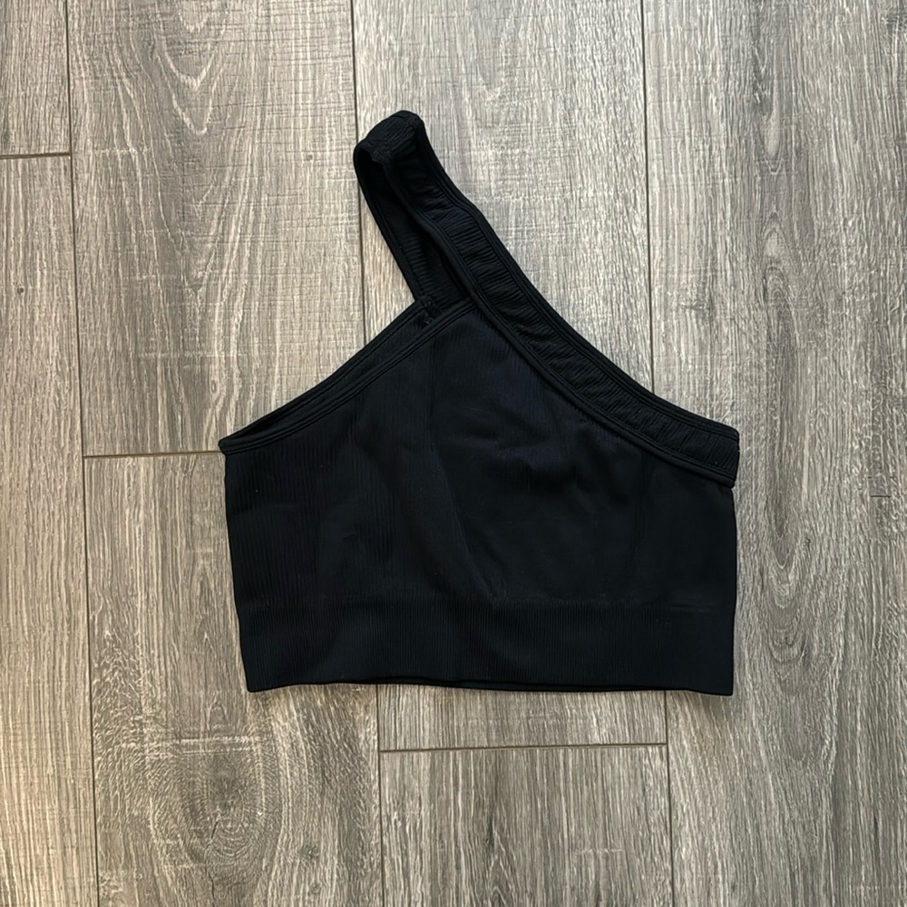 Black, one strap sports bra/crop top. Never worn!